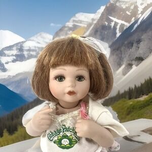 TC 1999 Porcelain Toddler Doll #217 with Brunette Hair and Blue eyes Collectible